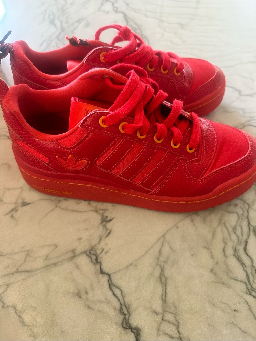 adidas Red Low-Top Sneakers with Yellow Eyelets